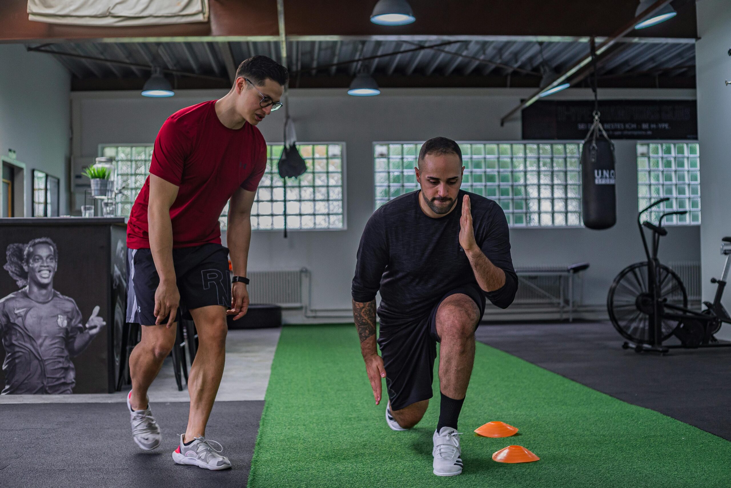 Photo by Justin L U C K from Pexels: https://www.pexels.com/photo/strong-sportsman-doing-exercises-with-instructor-5646004/